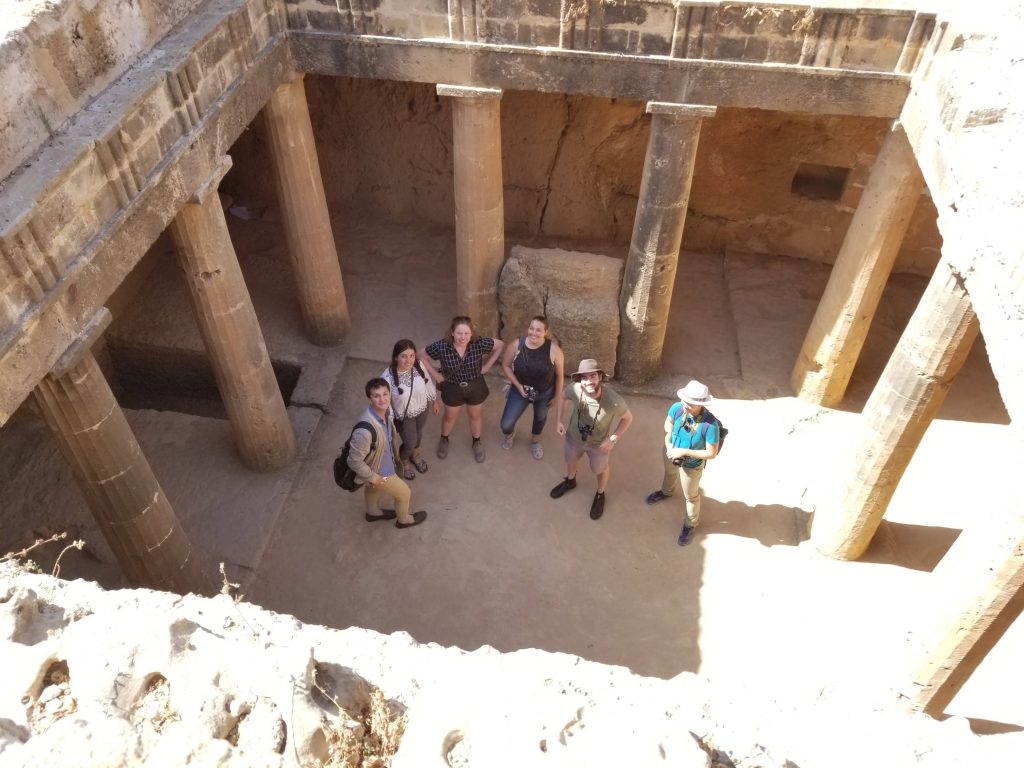 Looking down onto students standing in a peristyle court