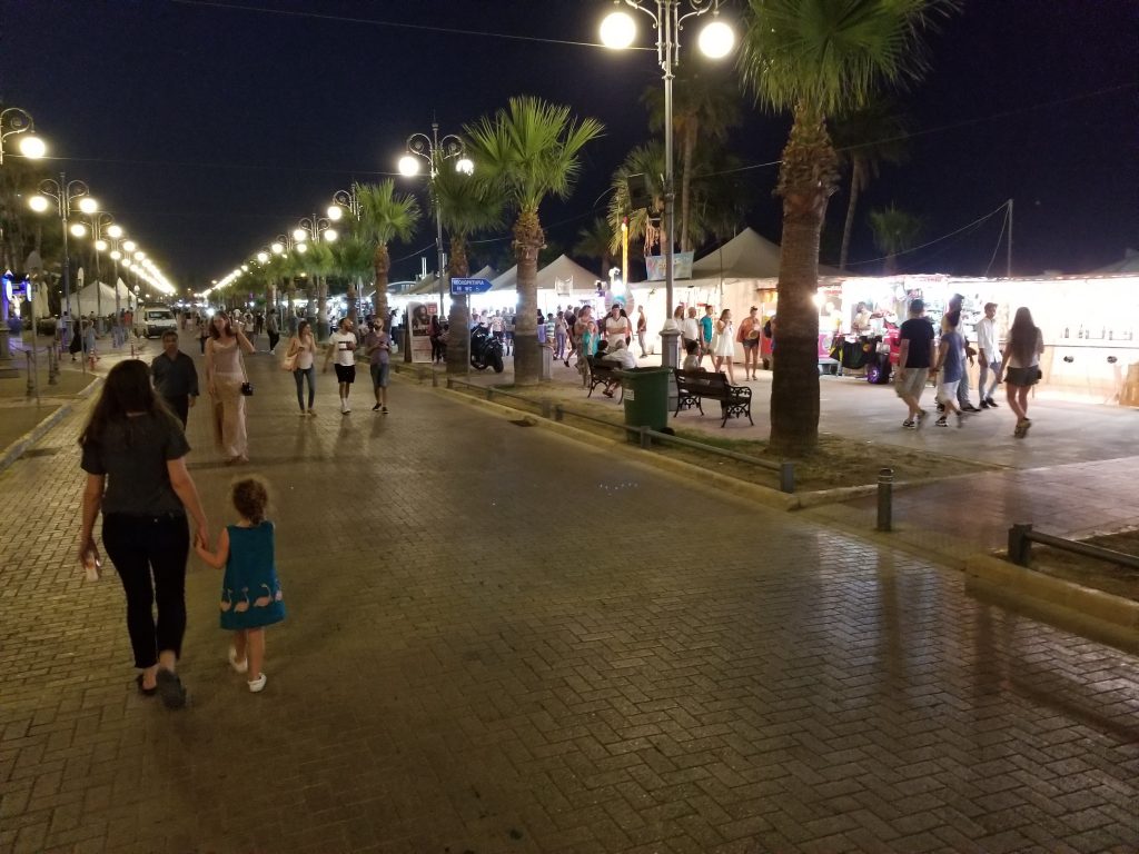A street lined with brightly lit booths