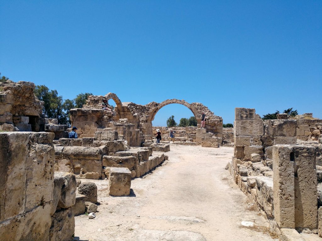 People climb on the ruins of a castle