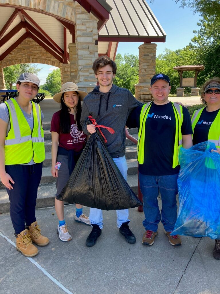 Tina Le, class of 2008, picture second from the left, poses with fellow volunteers for Nasdaq's Green Team during a local volunteer cleanup event. 