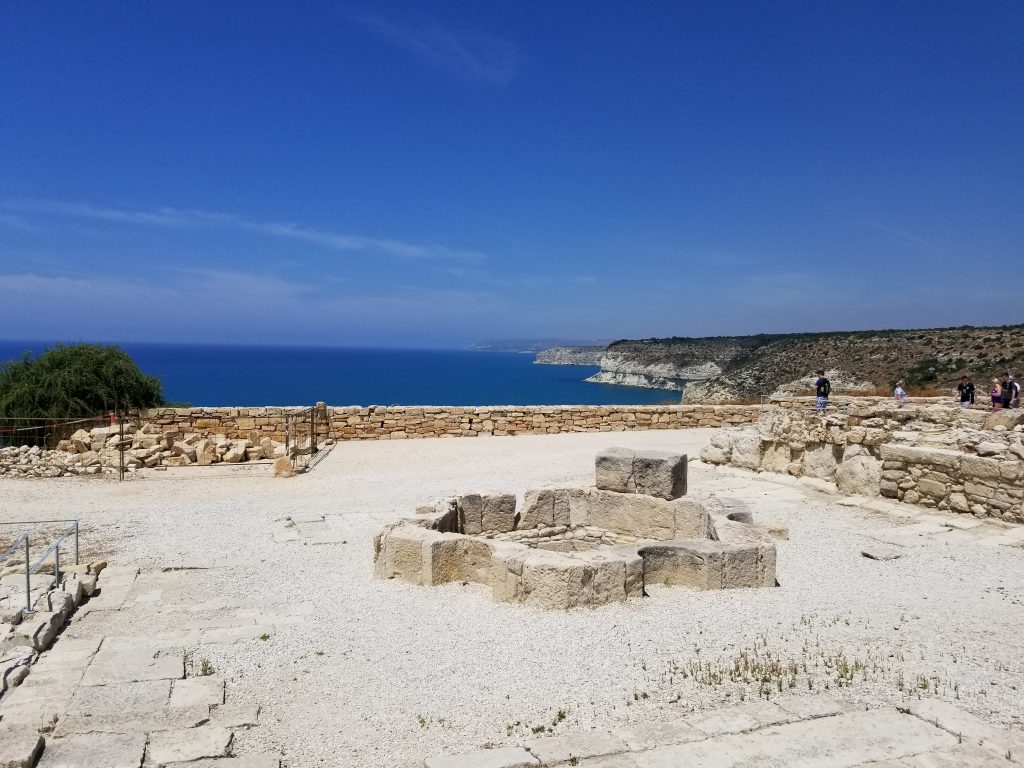 Archaeological remains overlooking the blue sea and white limestone cliffs